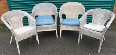 Lot 1035 - Four IKEA wicker conservatory tub chairs, and...