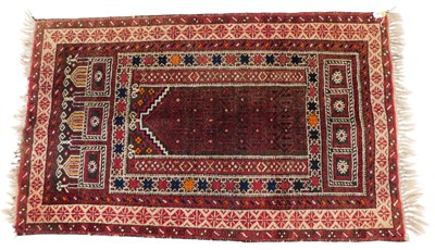 Lot 858 - A Persian Belouch rug, with a geometric design...