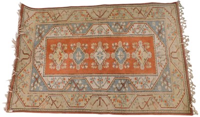 Lot 862 - A Turkish rug, with a design of medallions on...