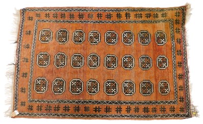 Lot 864 - A Persian rug, with a design of medallions, on...