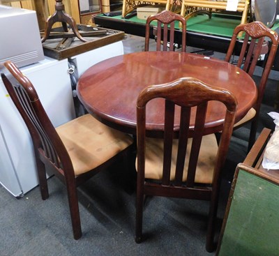 Lot 1071 - A circular topped dark wood dining table, and...