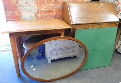 Lot 1081 - An oak fall front bureau, an oval bevelled...