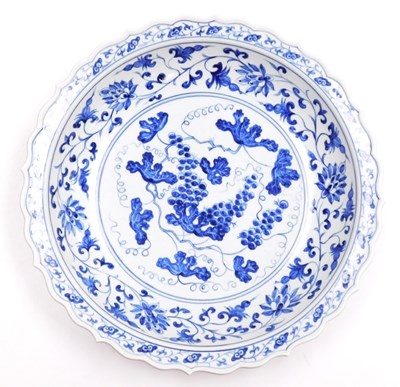 Lot 3 - A Qing dynasty blue and white dish, with a...