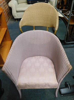 Lot 1082 - A pink coloured Lloyd Loom style tub chair,...