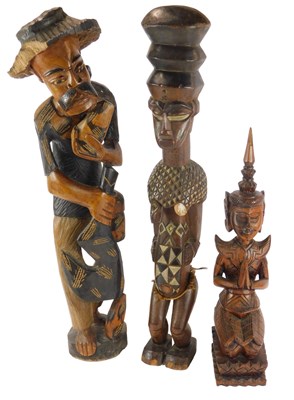 Lot 509 - A Thai carved hardwood figure, modelled...