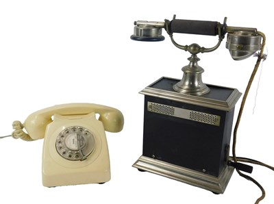 Lot 517 - A mid 20thC dial telephone, in cream plastic...