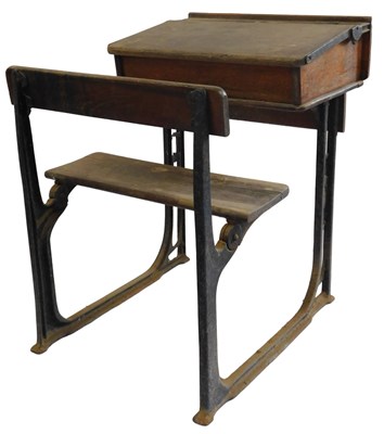 Lot 35 - A 20thC oak school desk, with ink recess, a...