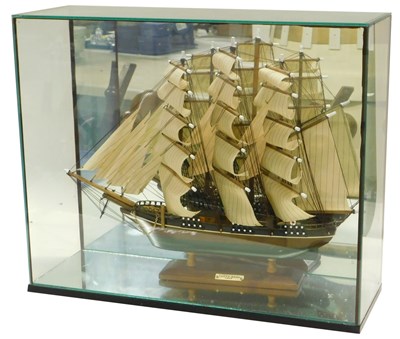 Lot 528 - A wooden model of the Cutty Sark, contained in...