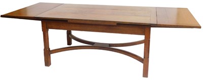 Lot 548 - An early 20thC oak draw leaf dining table, on...