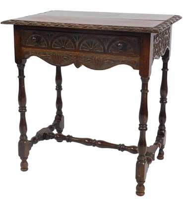 Lot 556 - A Victorian oak side table, the rectangular...