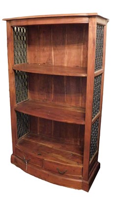 Lot 585 - An Eastern hardwood bow front bookcase, with...