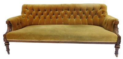 Lot 571 - A 19thC walnut framed sofa, upholstered in...