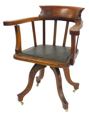 Lot 578 - An early 20thC oak captain's chair, with a...