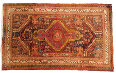 Lot 588 - A Turkish pink ground rug, with central...