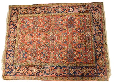 Lot 590 - A Heriz pink ground rug, decorated centrally...