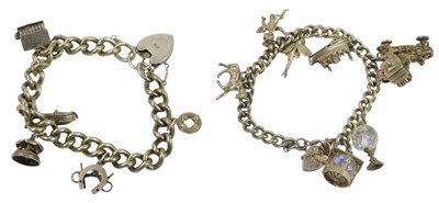 Lot 235 - Two silver charm bracelets with charms, approx...