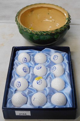 Lot 2164 - A set of twelve St Andrews golf balls, and a...