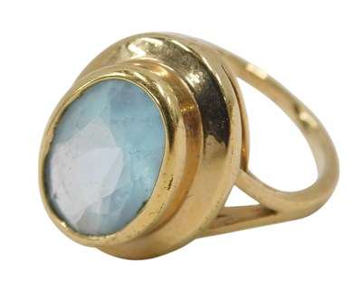 Lot 437 - An aquamarine dress ring, the ring set with...