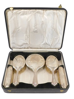 Lot 758 - A George V silver mounted dressing table set,...