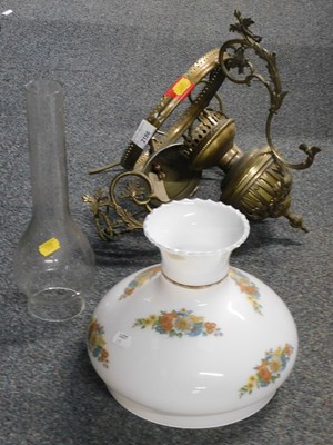 Lot 2186 - A hanging oil lamp, with shade and chimney,...