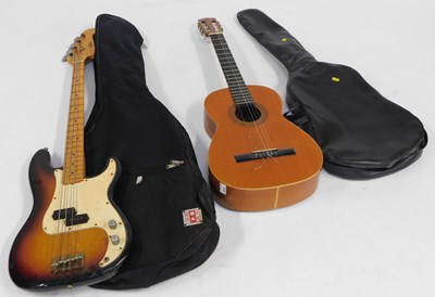 Lot 2210 - A Spanish style guitar, in bag, and a bass...