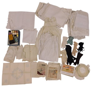 Lot 250 - A group of textiles, to include gloves,...