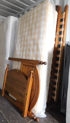 Lot 1090 - Two single mattresses with pine  bed frames.