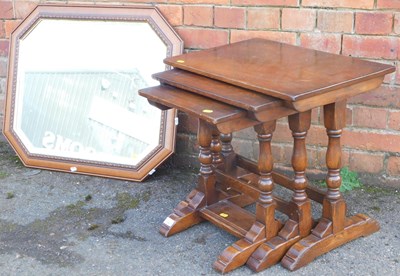 Lot 1083 - A nest of three oak occasional tables, and a...