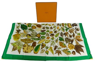 Lot 616 - A Hermes silk scarf, decorated with autumnal...