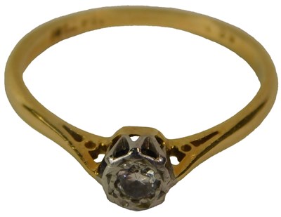 Lot 612 - A diamond solitaire ring, in yellow and white...