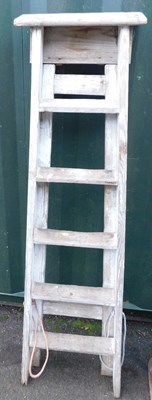 Lot 1105 - A set of wooden step ladders.