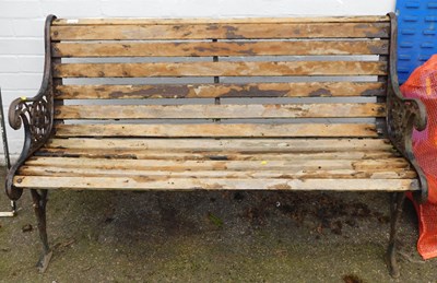 Lot 1130 - A garden bench, with slatted seat and back,...