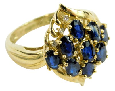 Lot 642 - A 9ct gold and sapphire cluster ring, size O,...