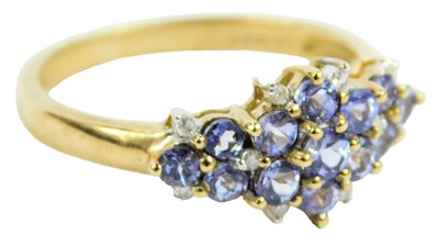Lot 645 - A 9ct gold and tanzanite dress ring, size O/P,...