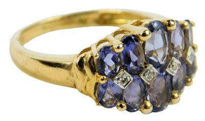 Lot 646 - A 9ct gold and tanzanite dress ring, size O, 3....
