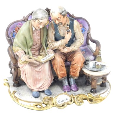 Lot 48 - A Capodimonte porcelain figure group, modelled...