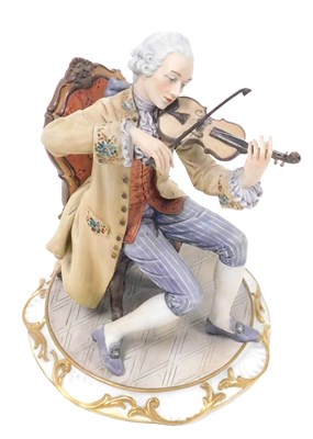 Lot 49 - A Capodimonte porcelain figure of a violinist,...