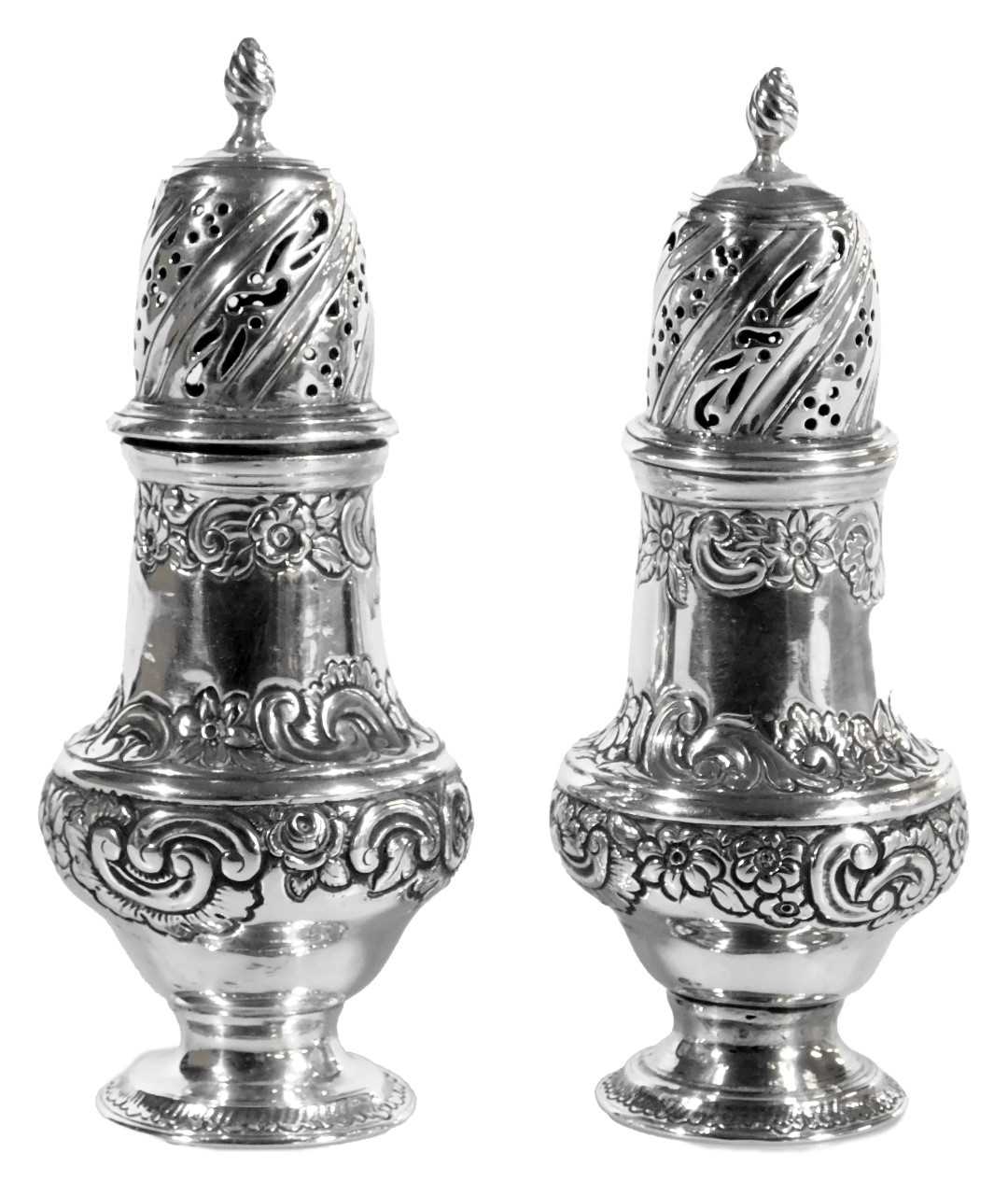 Lot 103 - A pair of George III silver sugar castors, of...