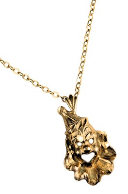 Lot 200 - A 9ct gold clown pendant, on a cable link neck...