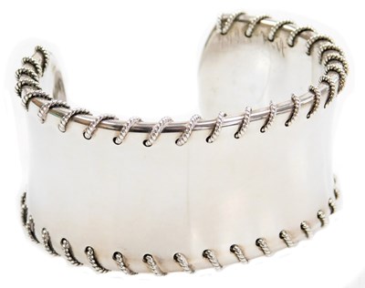 Lot 212 - A Tiffany & Company silver stich cuff, dated...