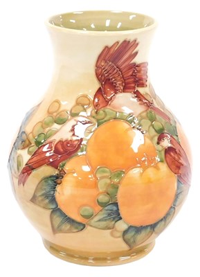 Lot 10 - A Moorcroft pottery Finches pattern vase, of...