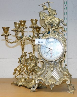 Lot 2084 - A brass clock garniture, comprising of a...