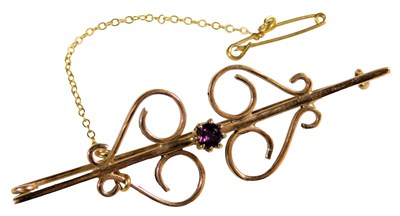 Lot 368 - A Victorian amethyst brooch, in a scrolling...