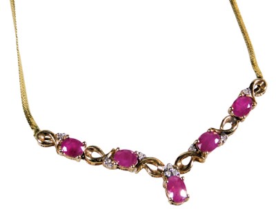 Lot 372 - A ruby and diamond necklace, in a V shaped...