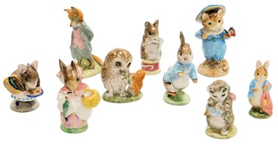 Lot 384 - A group of pottery Beatrix Potter figures,...