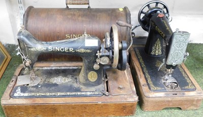 Lot 2133 - An oak cased Singer sewing machine, and...