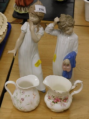 Lot 2162 - Two Nao porcelain figures, modelled as a boy...