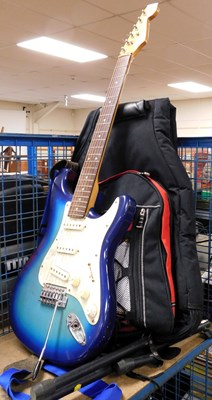 Lot 2260 - An electric guitar, in graduated blue,...