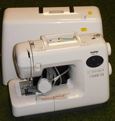 Lot 2332 - A cased Brother electric sewing machine.