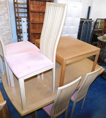 Lot 1002 - An oak extending dining table, the rectangular...